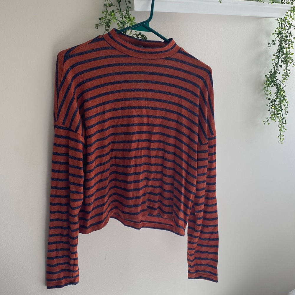 Dark blue and orange striped turtle neck